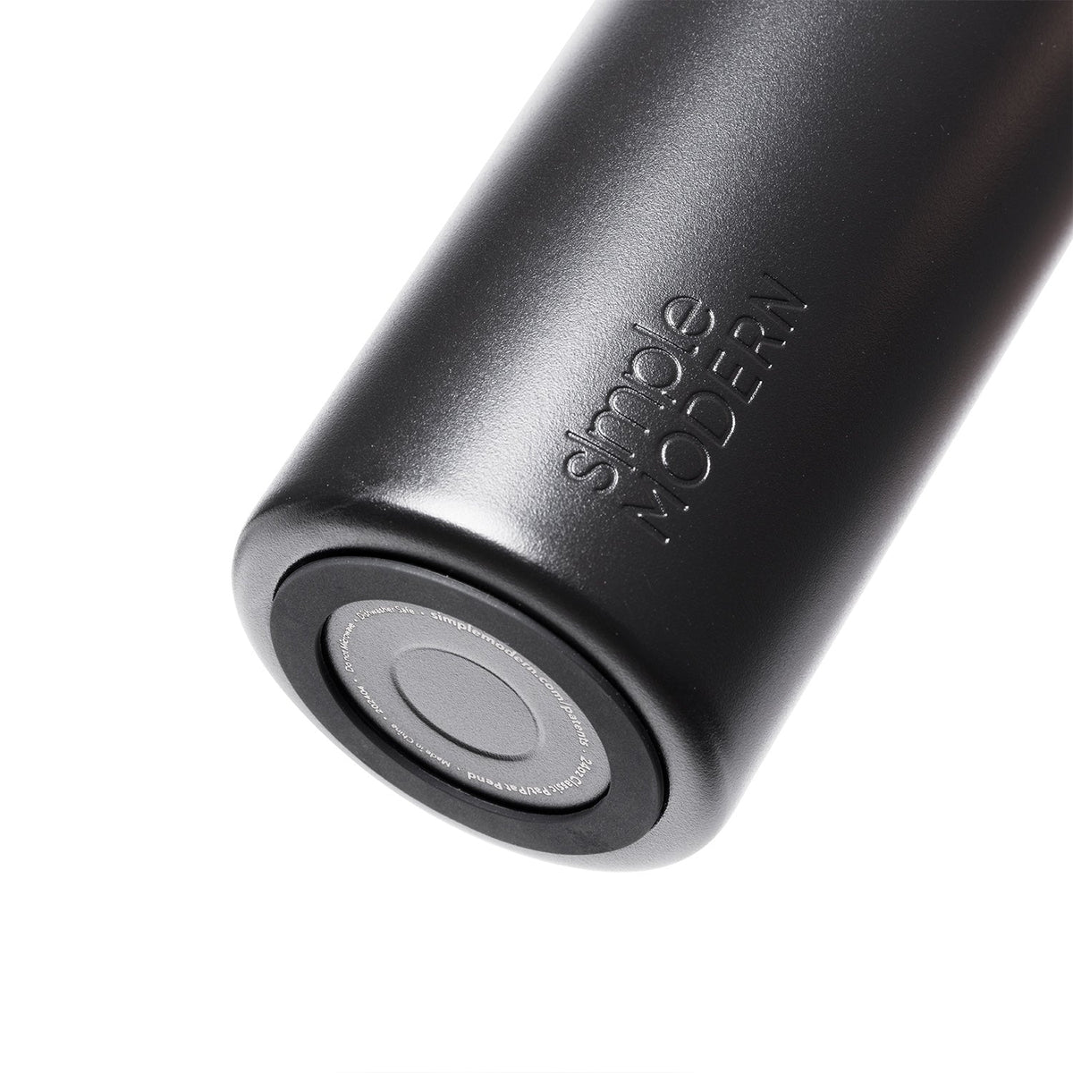 Dark gray silicone drinkware with matte finish and white base cap, shown against white background