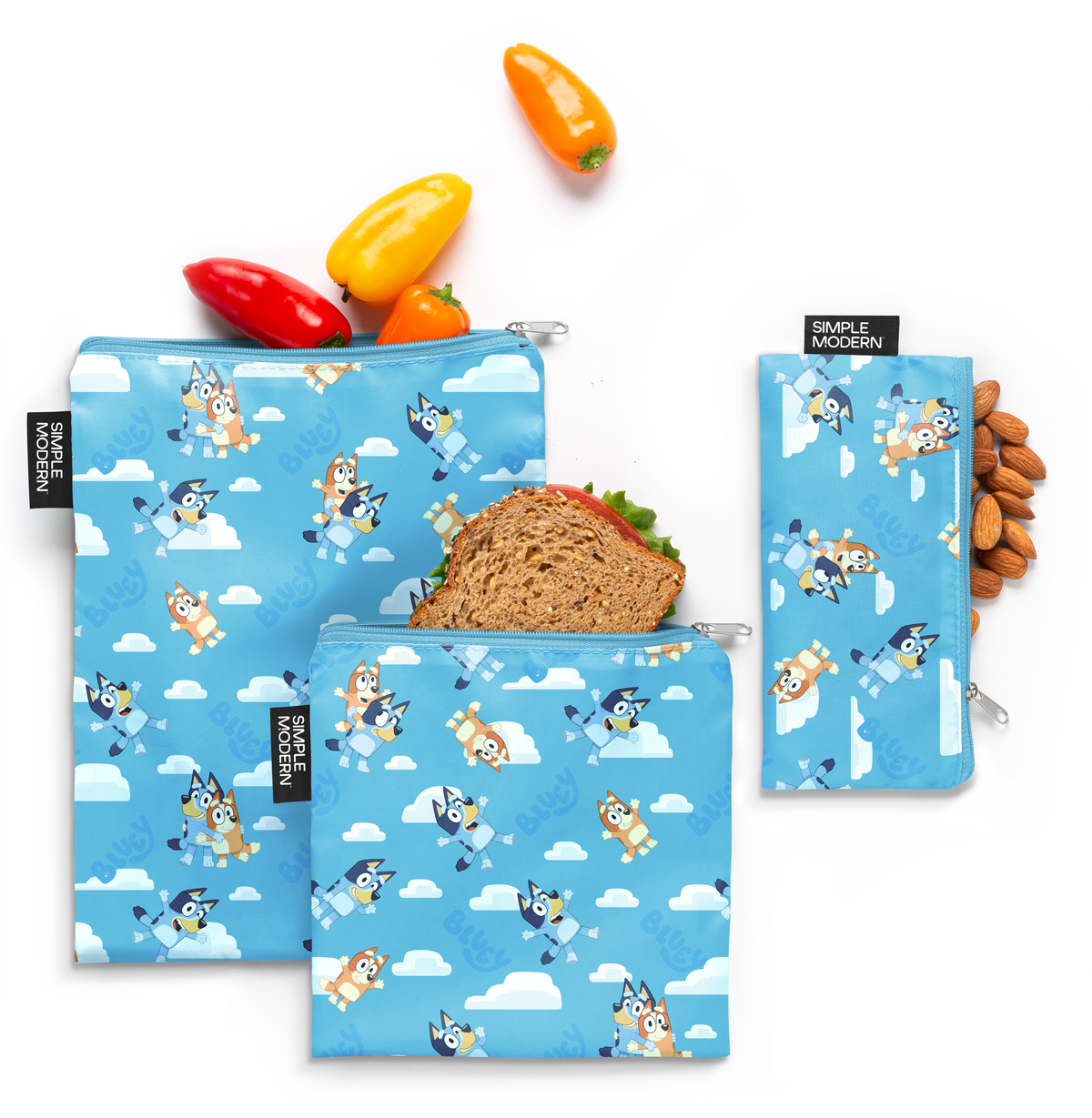 Three sky blue pouches with white clouds and vibrant orange, red, and yellow accents
