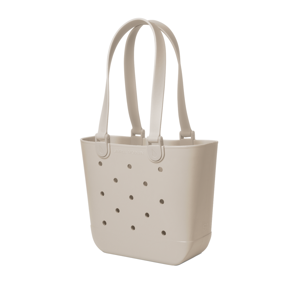 Cream-colored tote bag with handles and small circular perforations throughout the body, displayed on a neutral background.