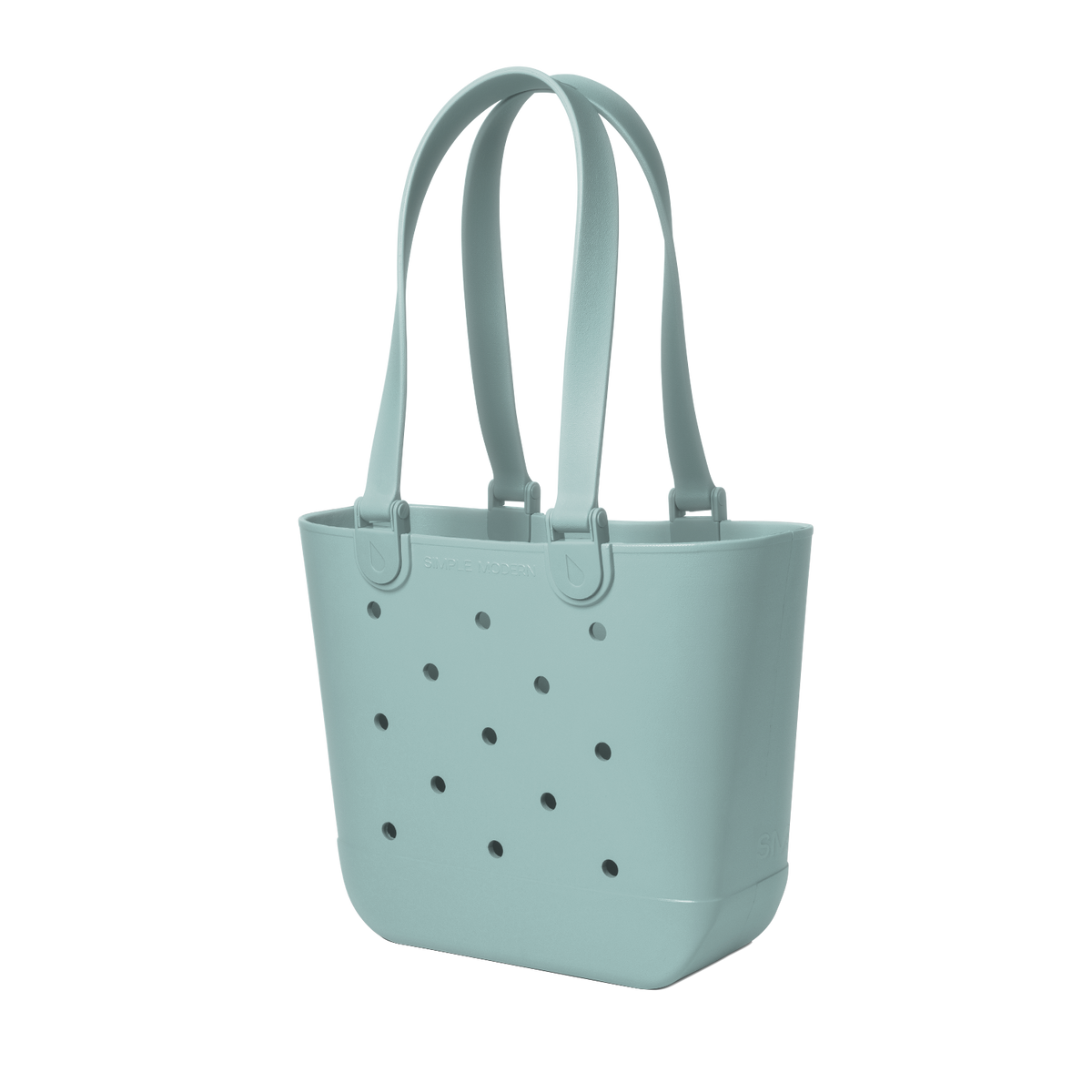 Soft sage green tote bag with small dark gray circular details, viewed from front