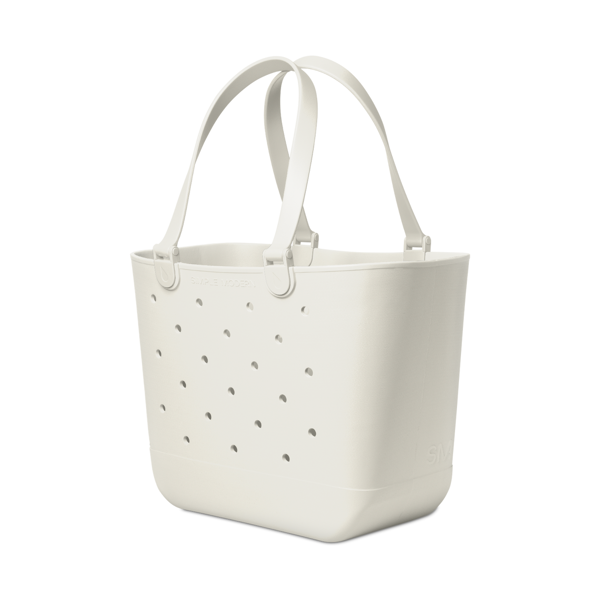 Cream-colored extra large tote bag with soft gray perforated details and subtle shadows, displayed against a white background.